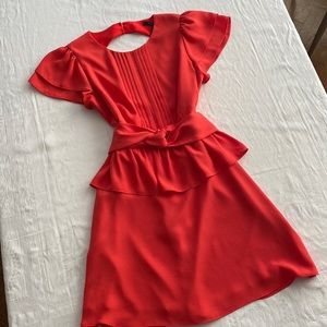 Perfect red dress. BCBG knee length dress in coral red. Open back. Size 8.